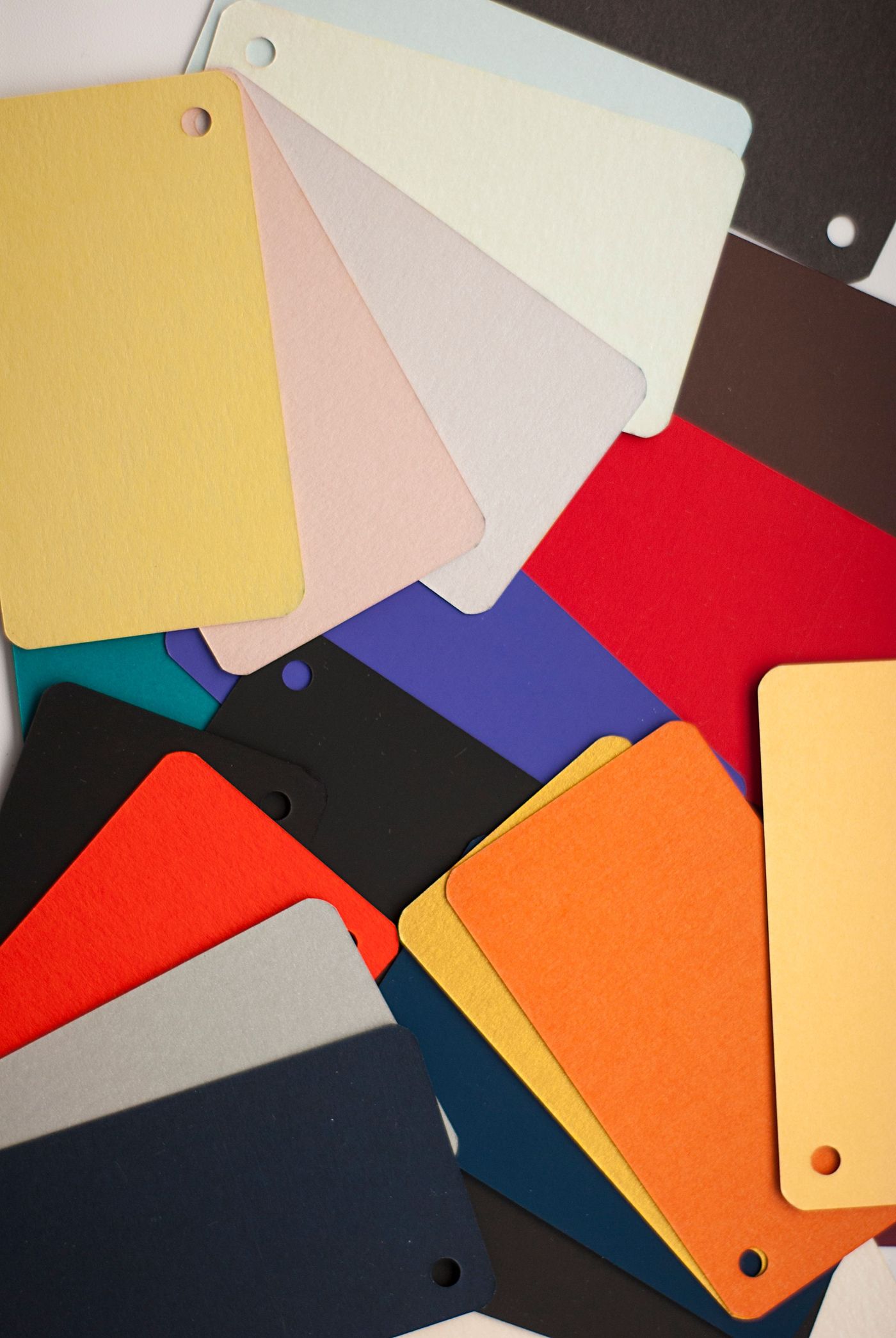A fanned stack of colored cardstock swatches