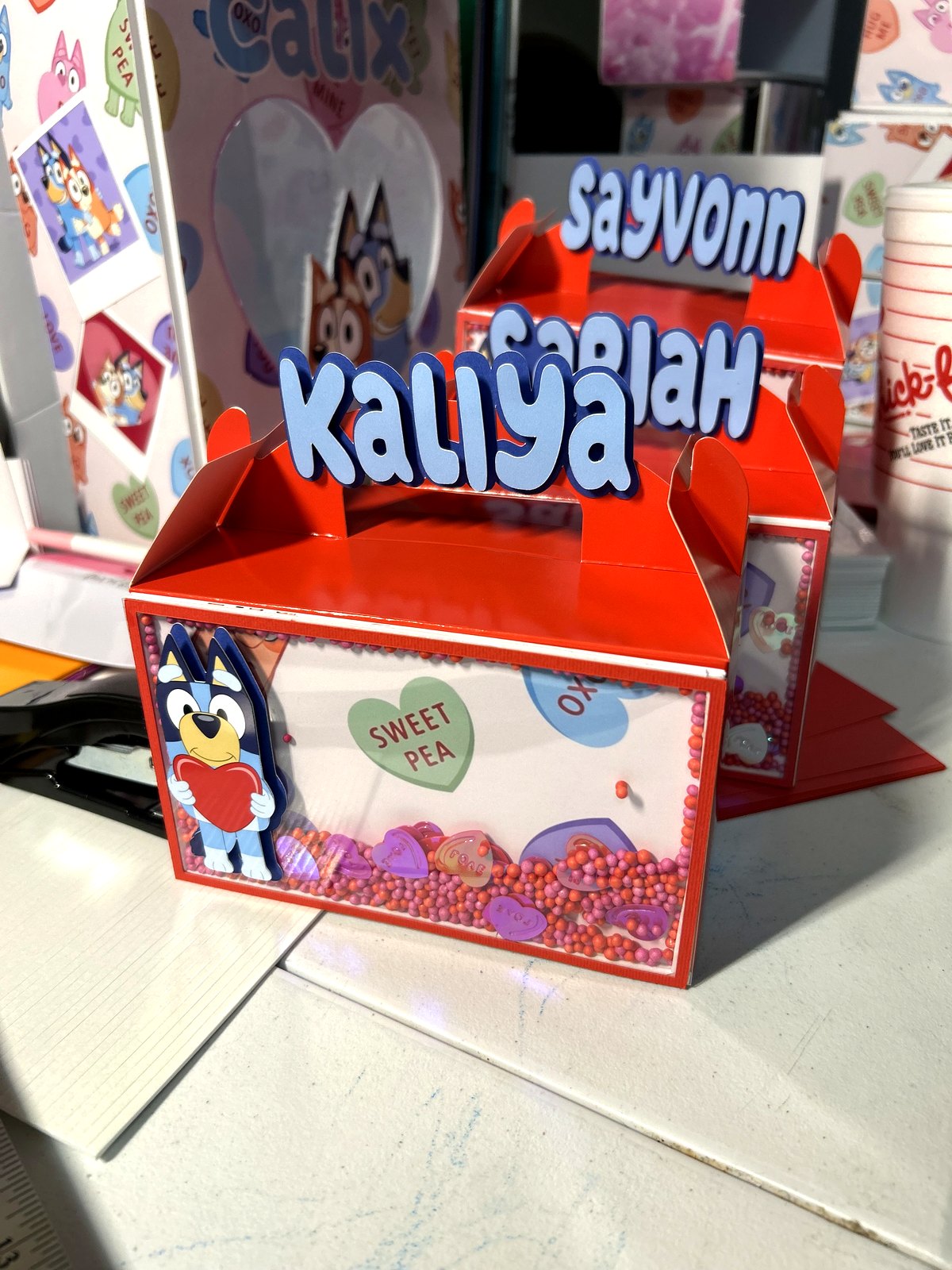 Red gable favor boxes with raised name letters, made by hand